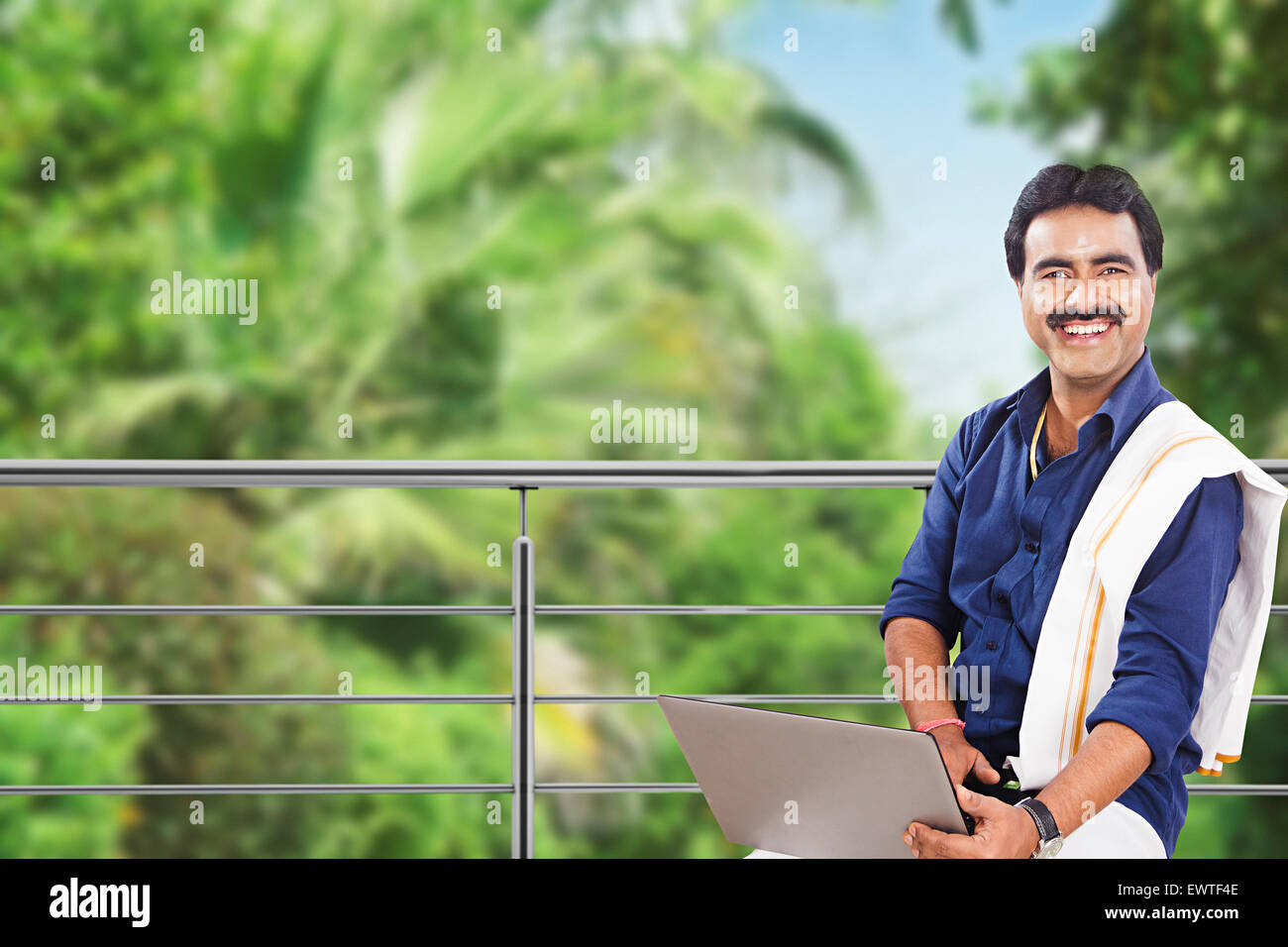 1 South Indian man laptop working Stock Photo