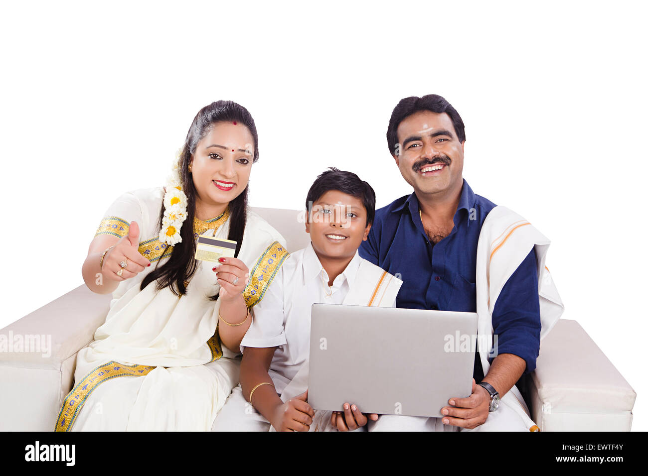 south Indian Parents and son laptop and Credit Card shopping Stock Photo