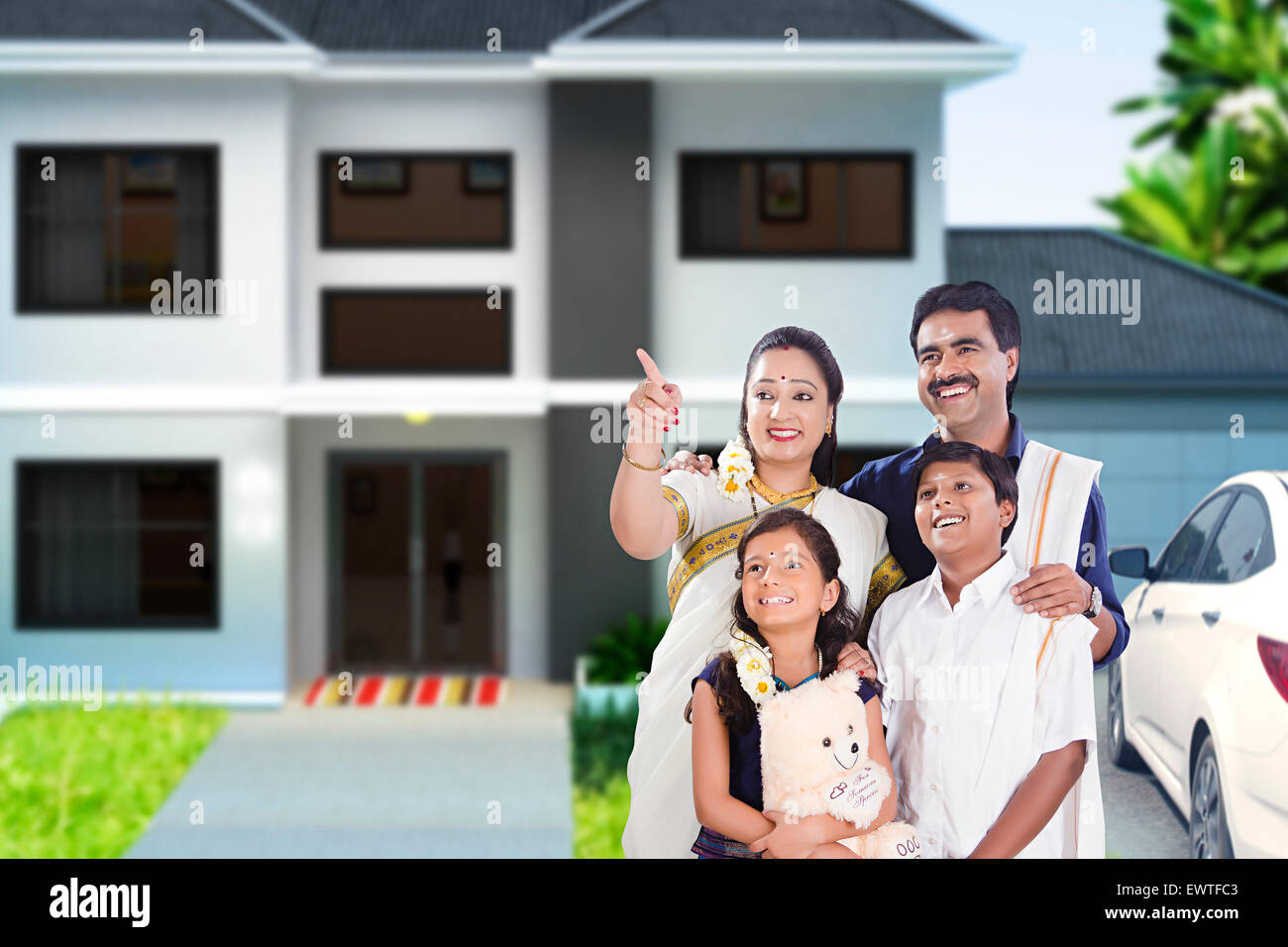 South Indian Parents and son Courtyard finger showing Stock Photo