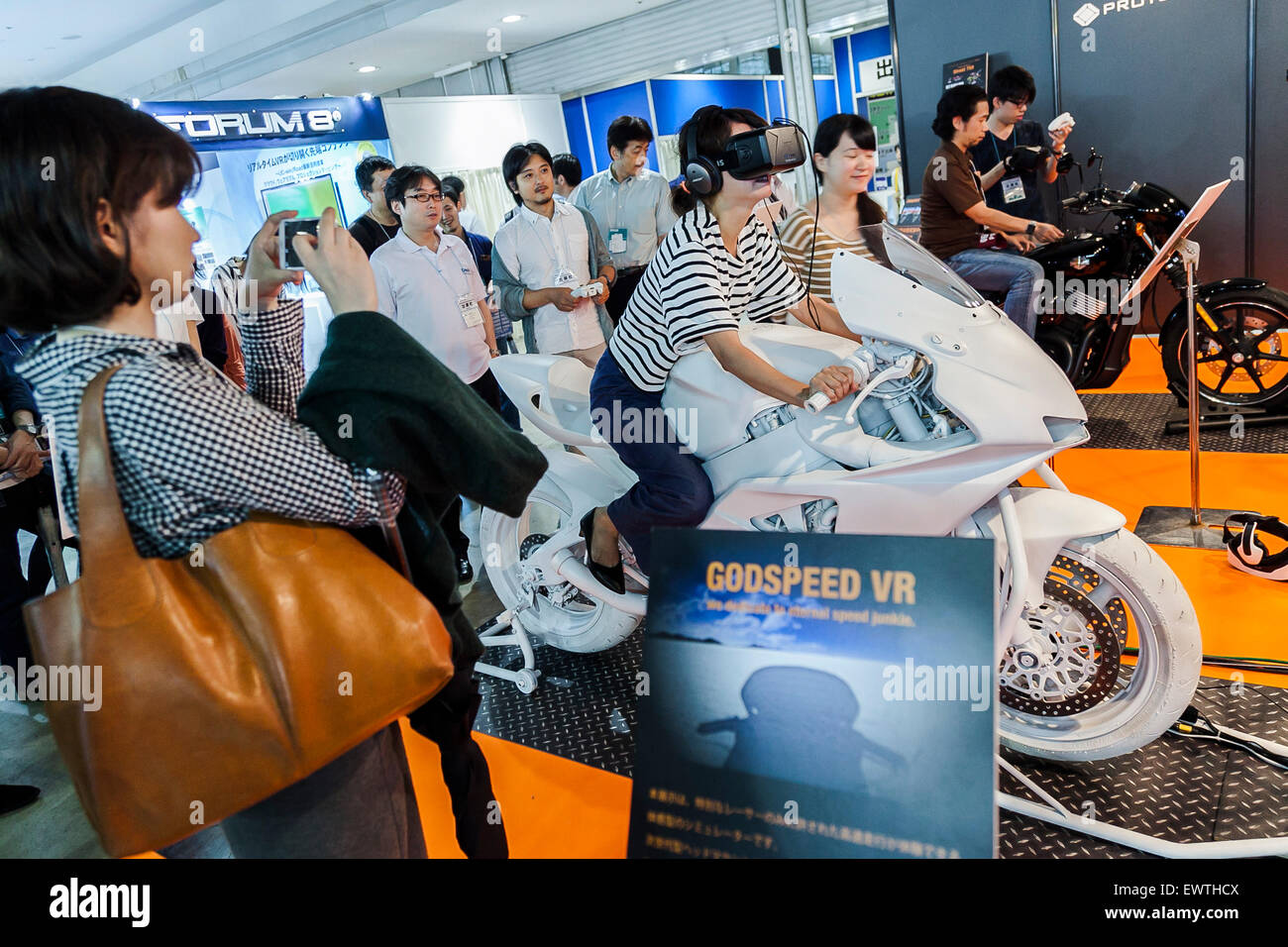 Tokyo, Japan. 1st July, 2015. A visitor tries a virtual reality