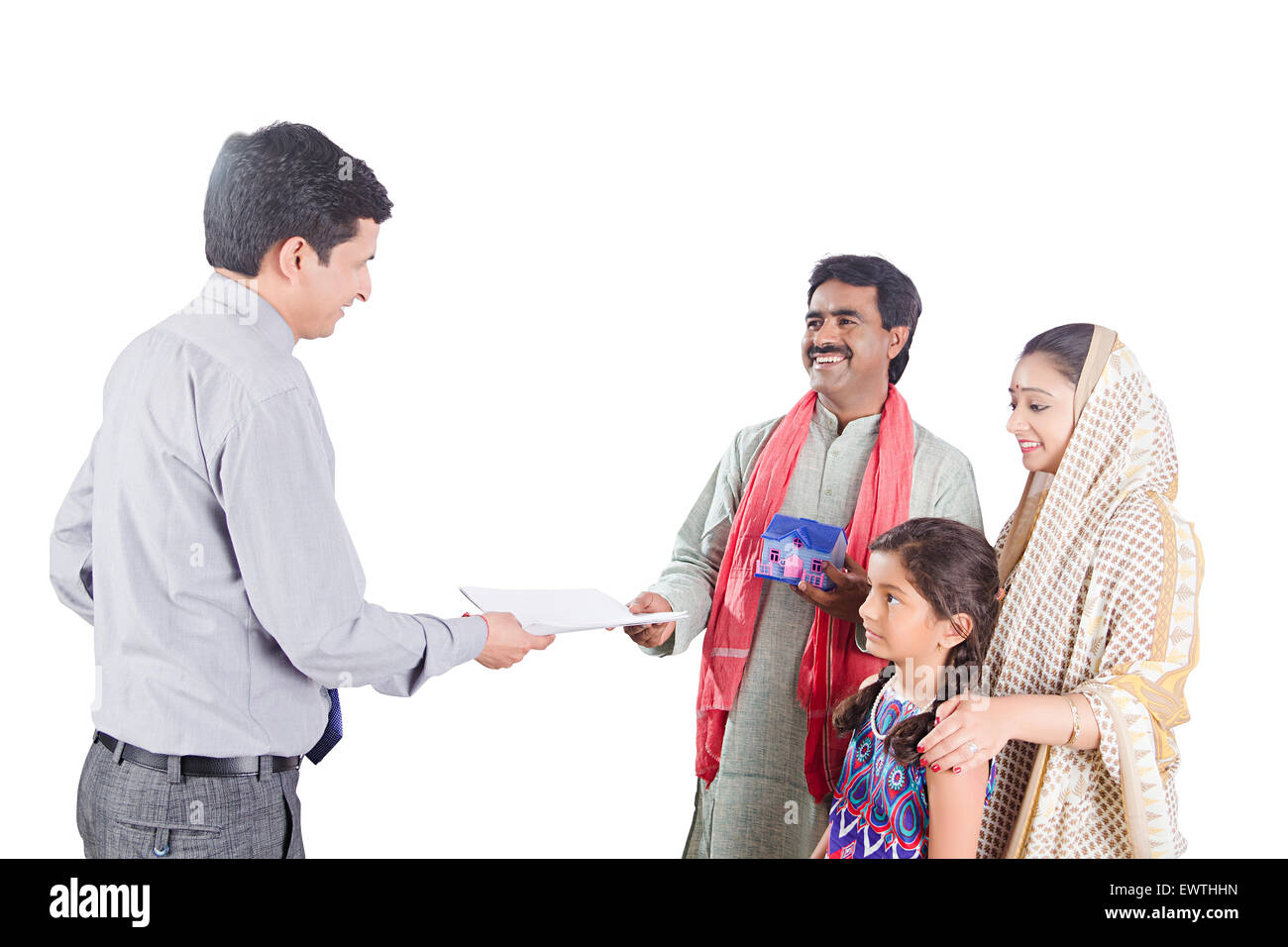 indian Rural Parents and Salesman Dealing new house Stock Photo