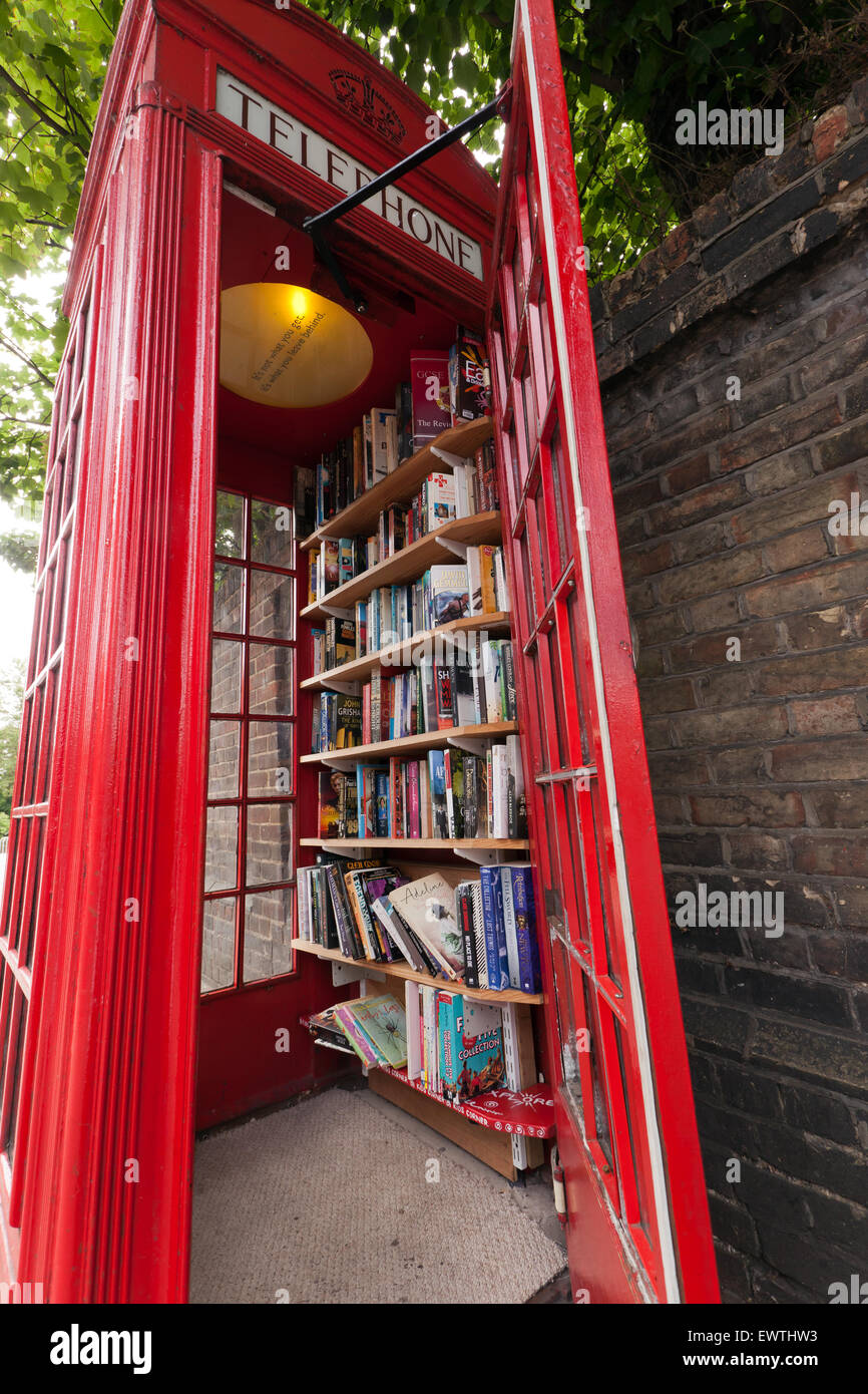 Wide-angle view  of the Lewisham Micro Library, in an old, red, Telephone box, on Loampit Hill, Lewisham. Stock Photo