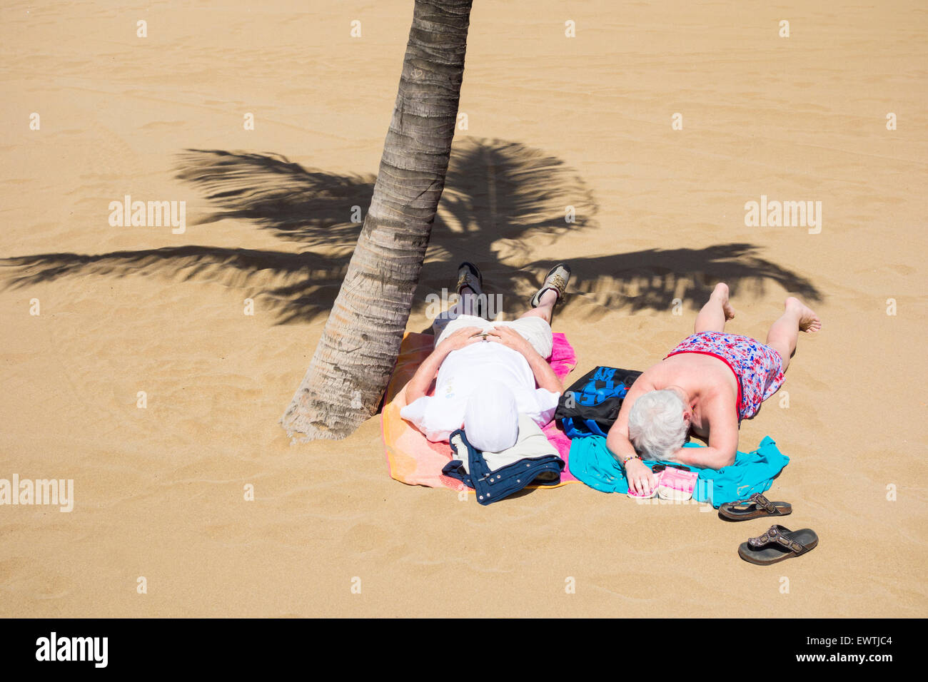 Mature woman sunbathing beach hi-res stock photography and images - Alamy