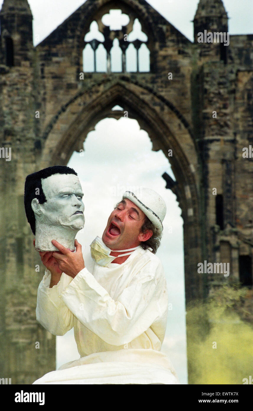 Photocall for Frankenstein at Gisborough Priory, performer Miklos Menis as Dr Frankenstein with the monster's head in front of the ruins. 27th July 1994. Stock Photo