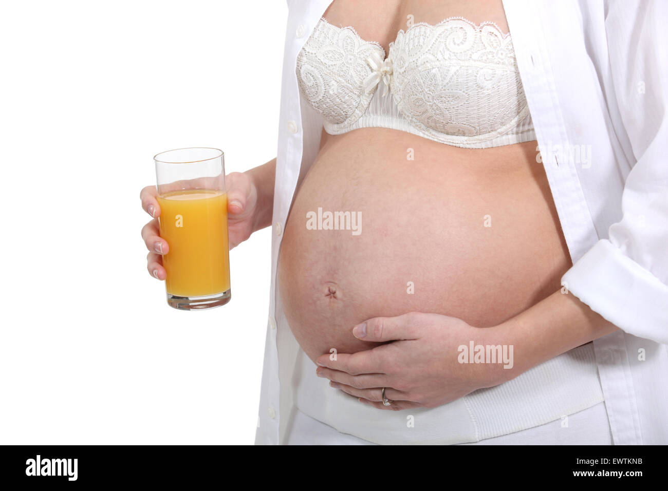 pregnant woman drinking orange juice Stock Photo Alamy