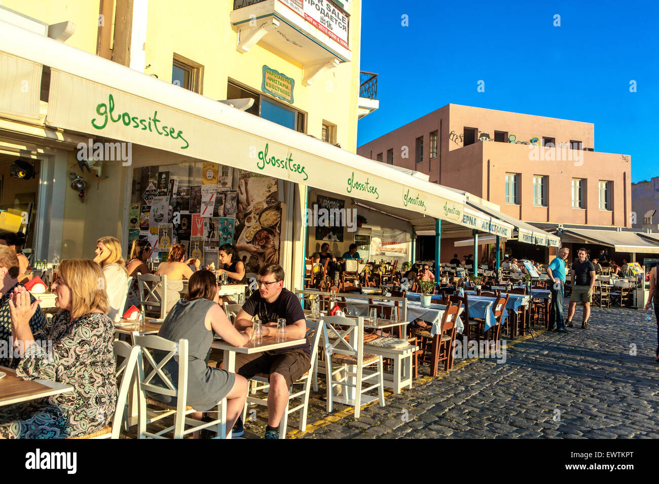 crete-chania-bar-with-people-dining-outside-old-venetian-harbour