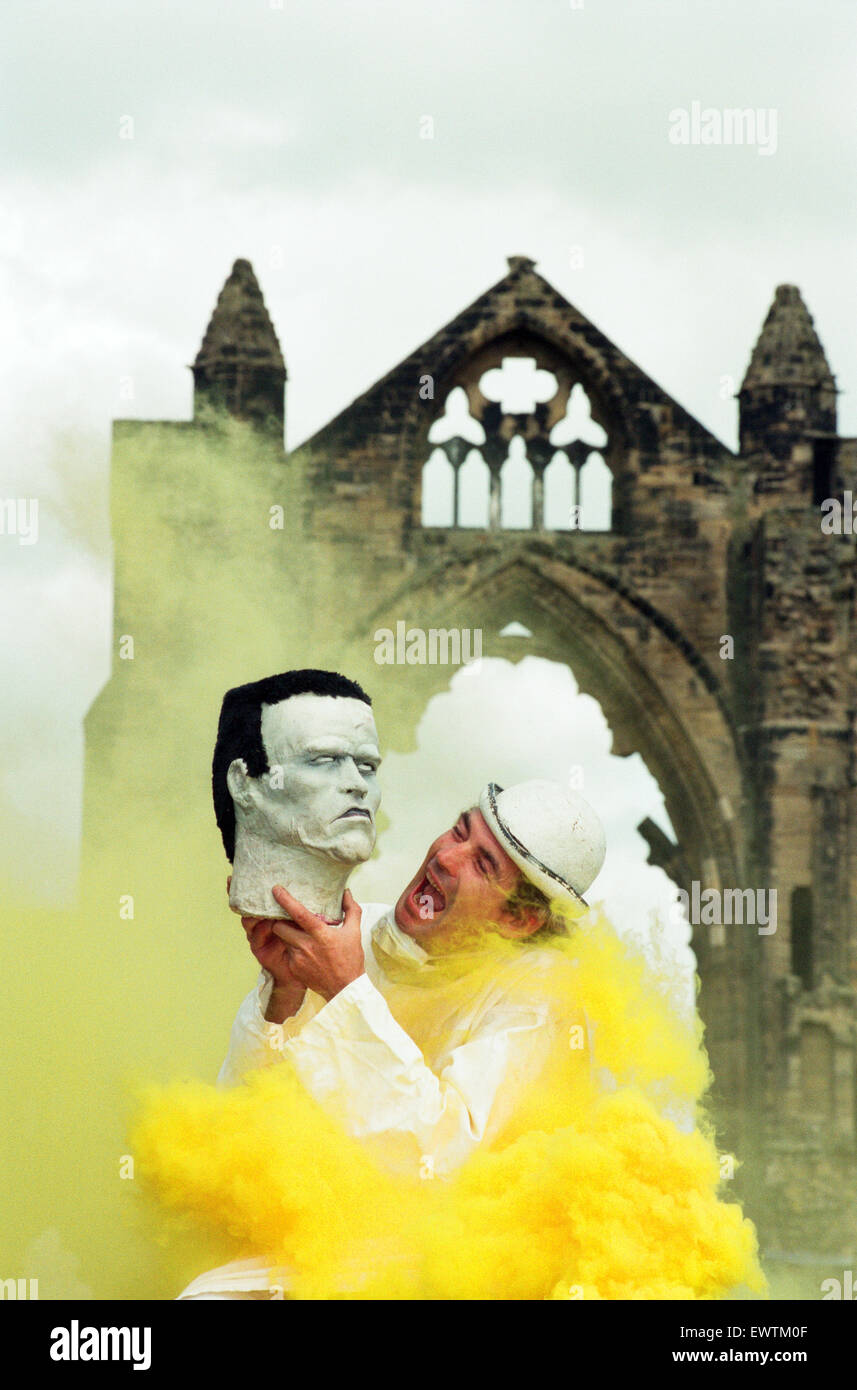 Photocall for Frankenstein at Gisborough Priory, performer Miklos Menis as Dr Frankenstein with the monster's head in front of the ruins. 27th July 1994. Stock Photo