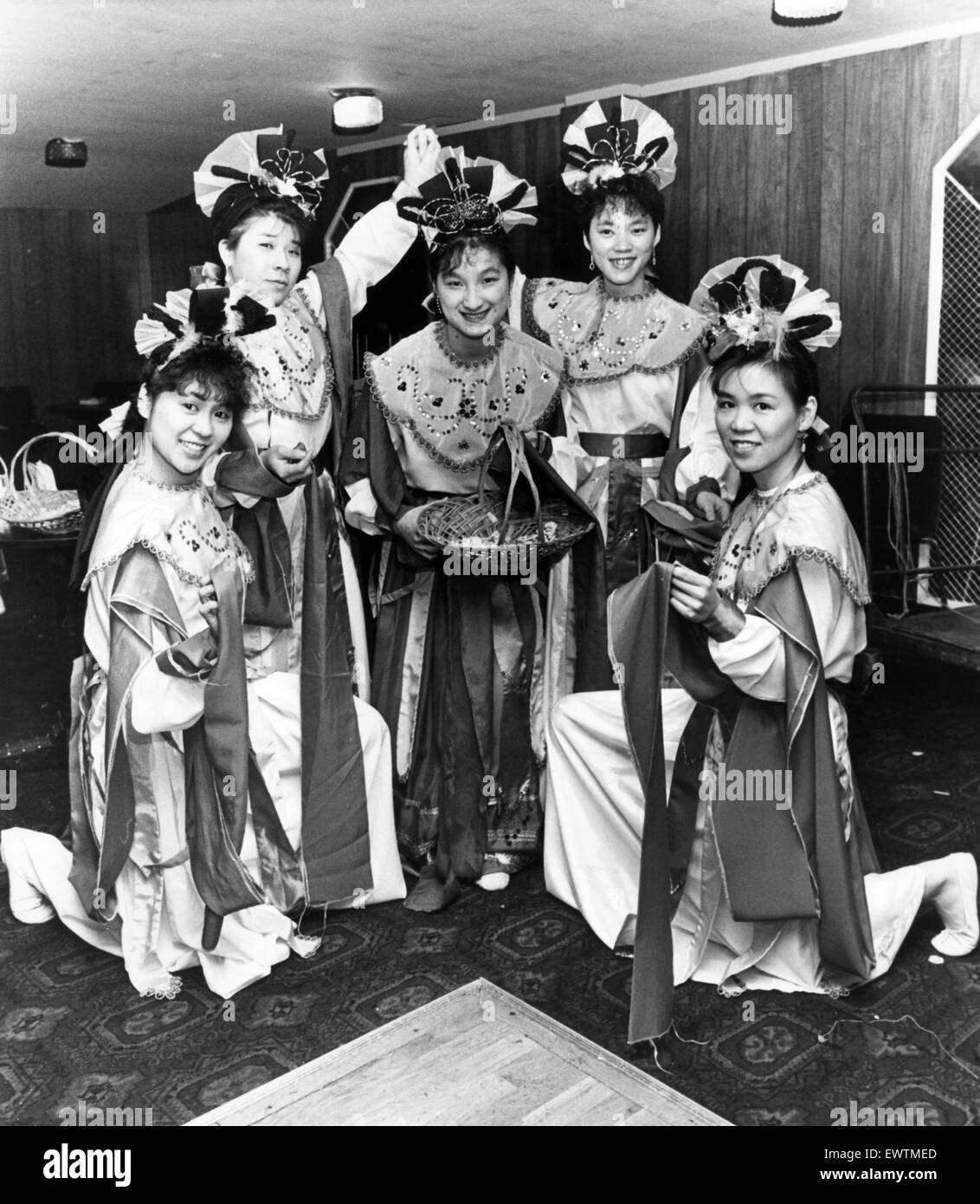 Chinese girls perform the Fairy's Flower Dance at the New Year Celebrations held at the Mayfair Ballroom, to celebrate the oncoming Year of the Dragon. 21st February 1988. Stock Photo