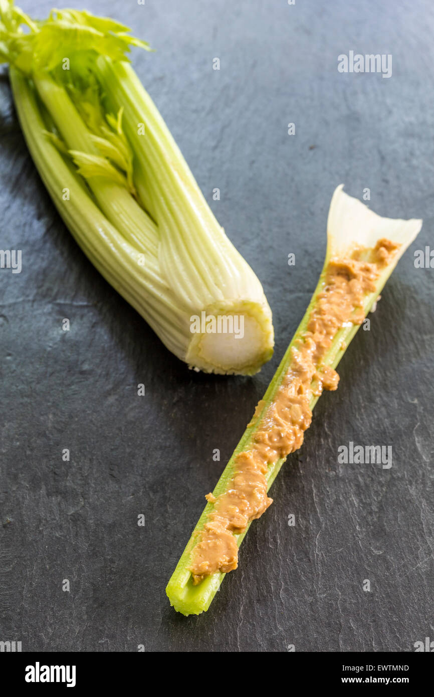 Celery with peanut butter on a slate snack Stock Photo Alamy