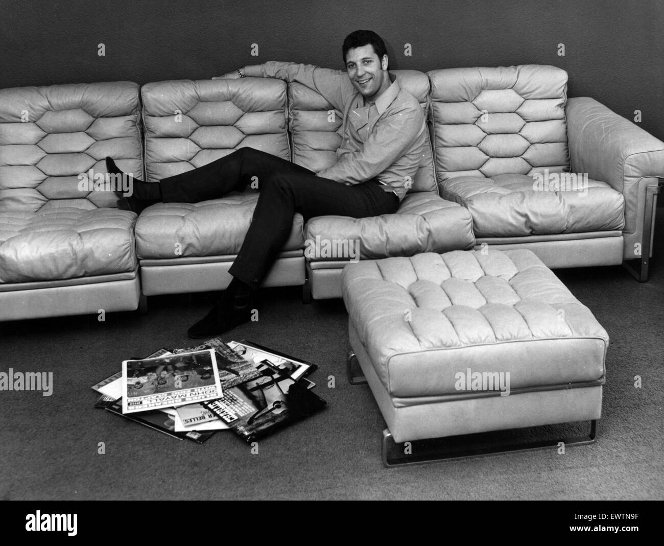 Tom Jones, at his new £25000 pound home in Swingfield Grove, Sunbury, Middlesex, 21st July 1967. Pictured relaxing on his new 1100 pound leather sofa. Stock Photo