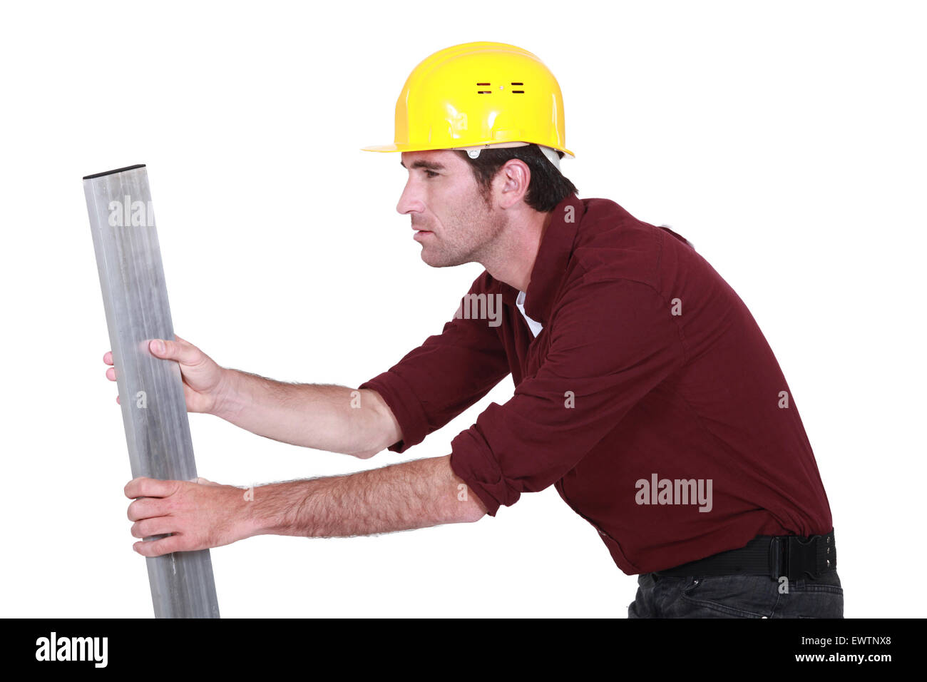Man inspecting metal beam Stock Photo