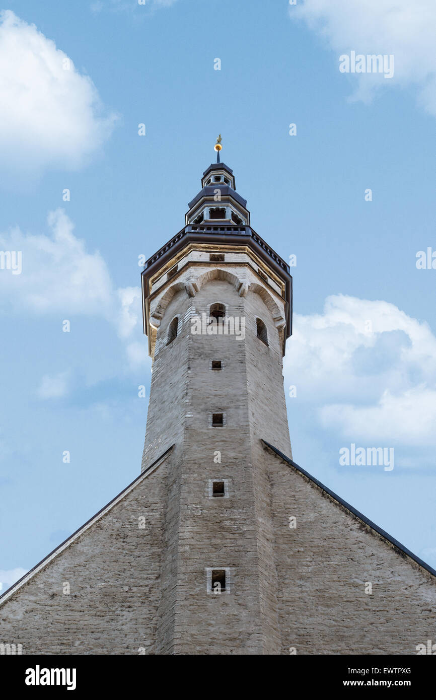 Close up detailed bottom view of medieval Lutheran Church of the Holy Ghost in Tallinn, Estonia, on blue cloudy sky background. Stock Photo
