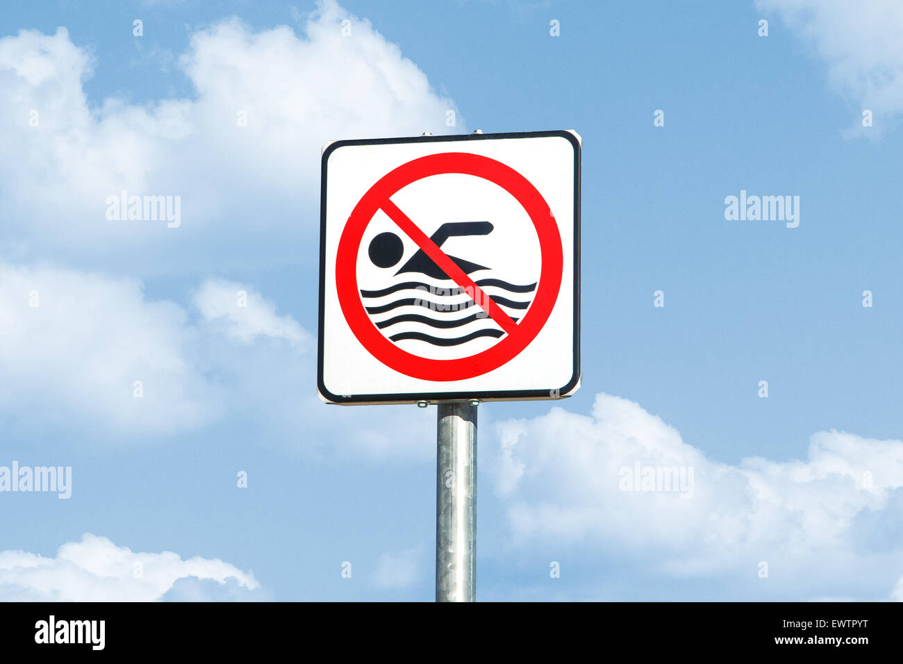 Front view of road sign with the message of swimming is forbidden, on ...