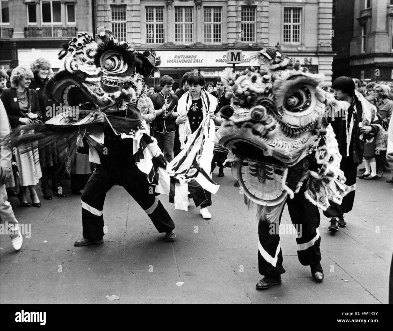 New Year Chinese style. A festive Dragon dance underway at Grey's Monument, Newcastle. 15th February 1983. Stock Photo