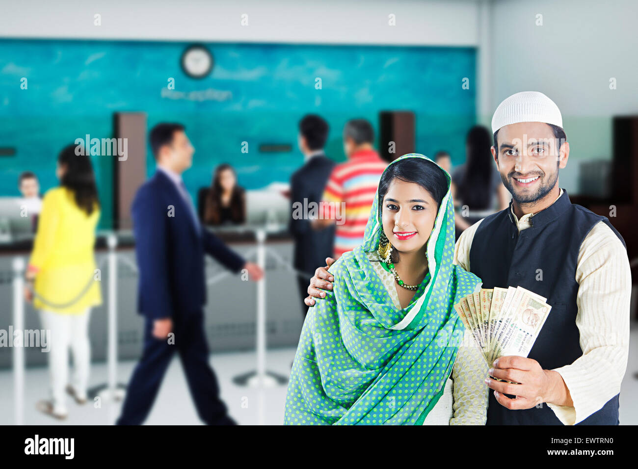 2 indian Muslim Married Couple showing money Stock Photo - Alamy