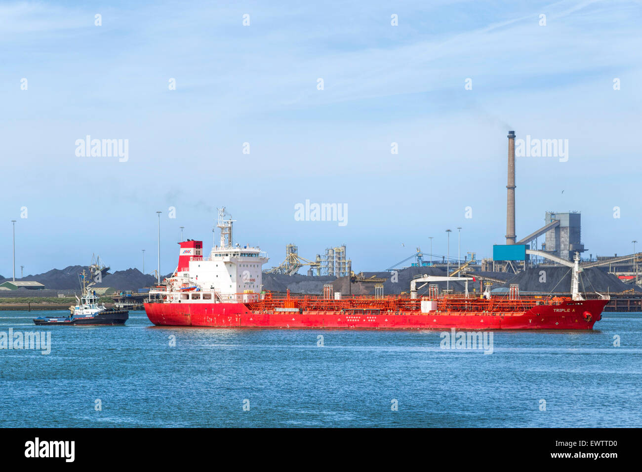 Triple A, an oil/chemical tanker passing IJmuiden Steelworks or Hoogovens, Velzen Locks, North Holland, Netherlands. Stock Photo