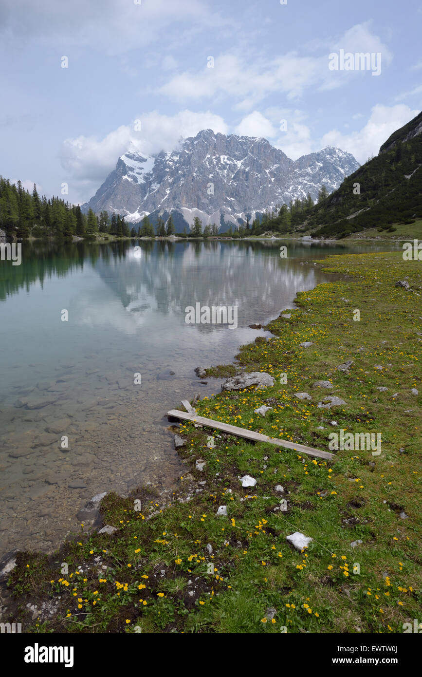 Zugspitze massif reflecting in mountain lake Seebensee, Austria Stock ...