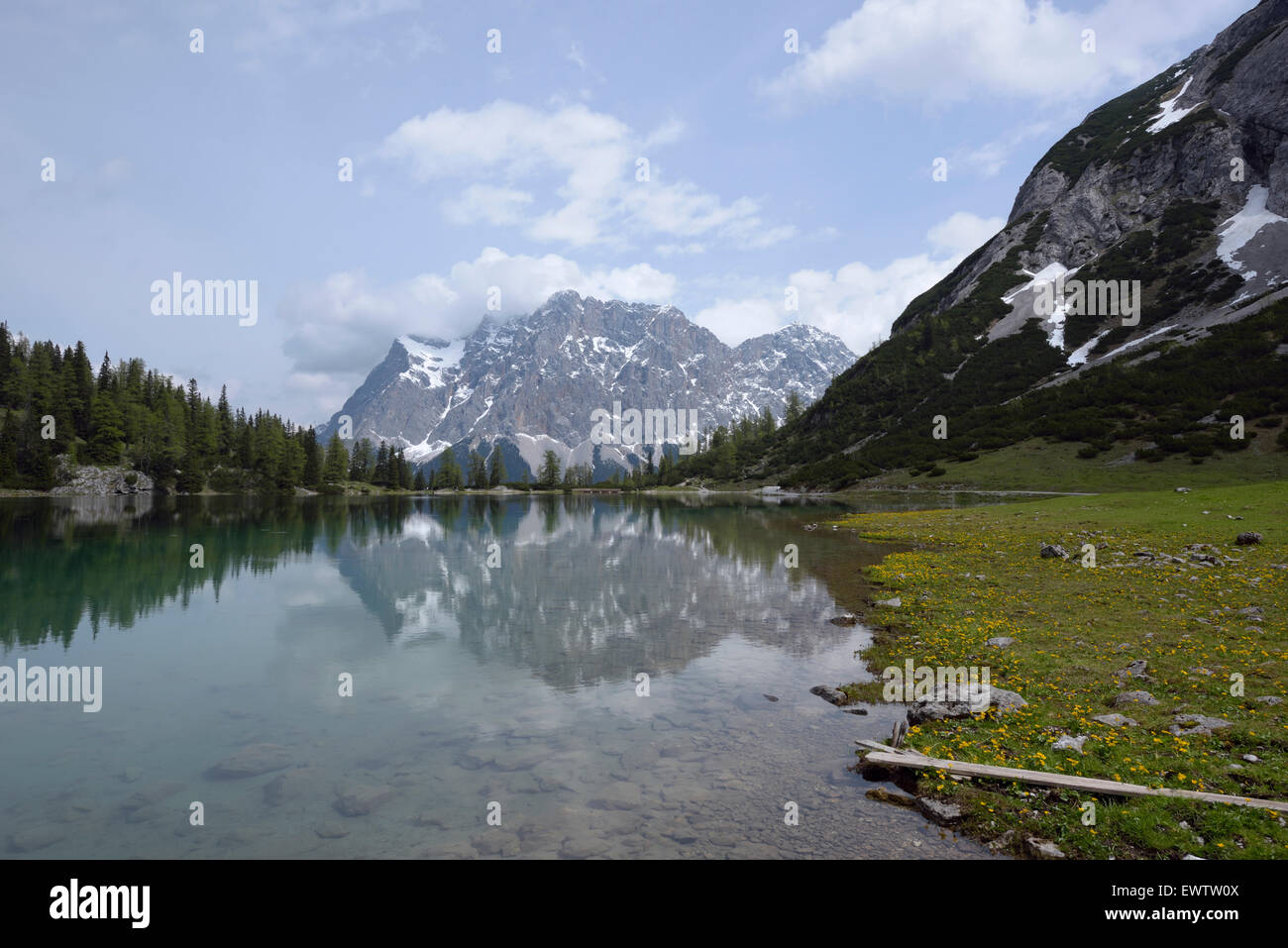 Zugspitze massif reflecting in mountain lake Seebensee, Austria Stock ...