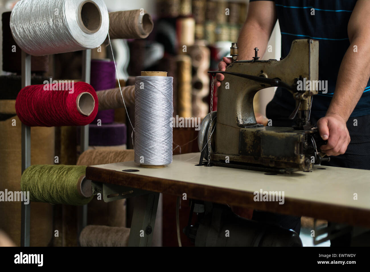 Carpet Designer With Sewing Machine Stock Photo Alamy