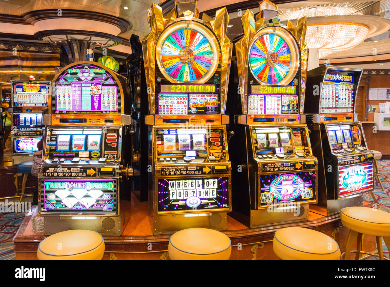 Slot machines in casino on board Royal Caribbean 'Brilliance of the Seas' cruise ship, North Sea, Europe Stock Photo