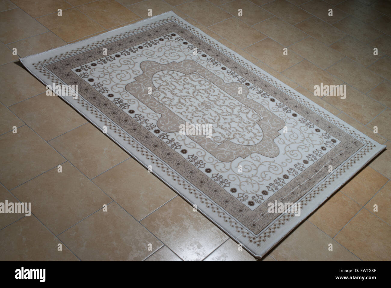 White Persian Rug Isolated On Tiles Stock Photo Alamy