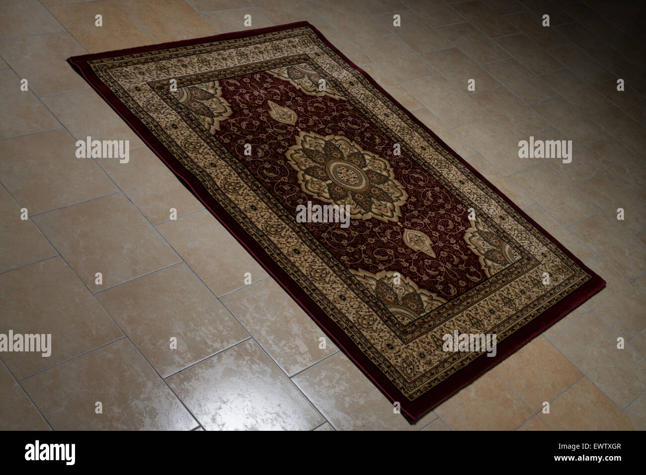 Persian Rug Isolated On Tiles Stock Photo Alamy