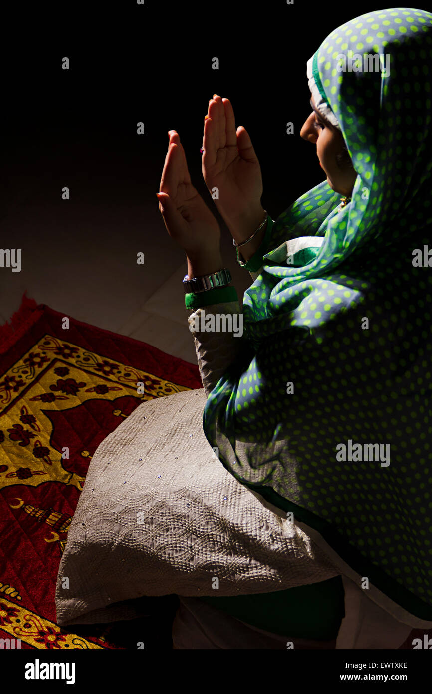 1 indian Muslim woman Namaz Stock Photo