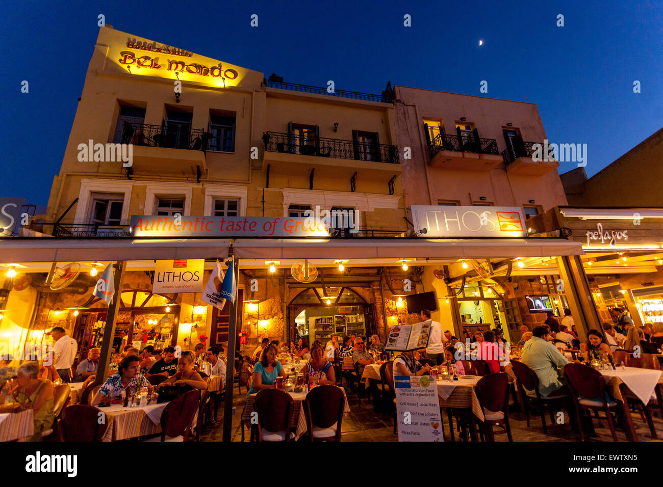 Chania bar Crete, Greece, Cafe in Old Venetian harbour at night Stock Photo