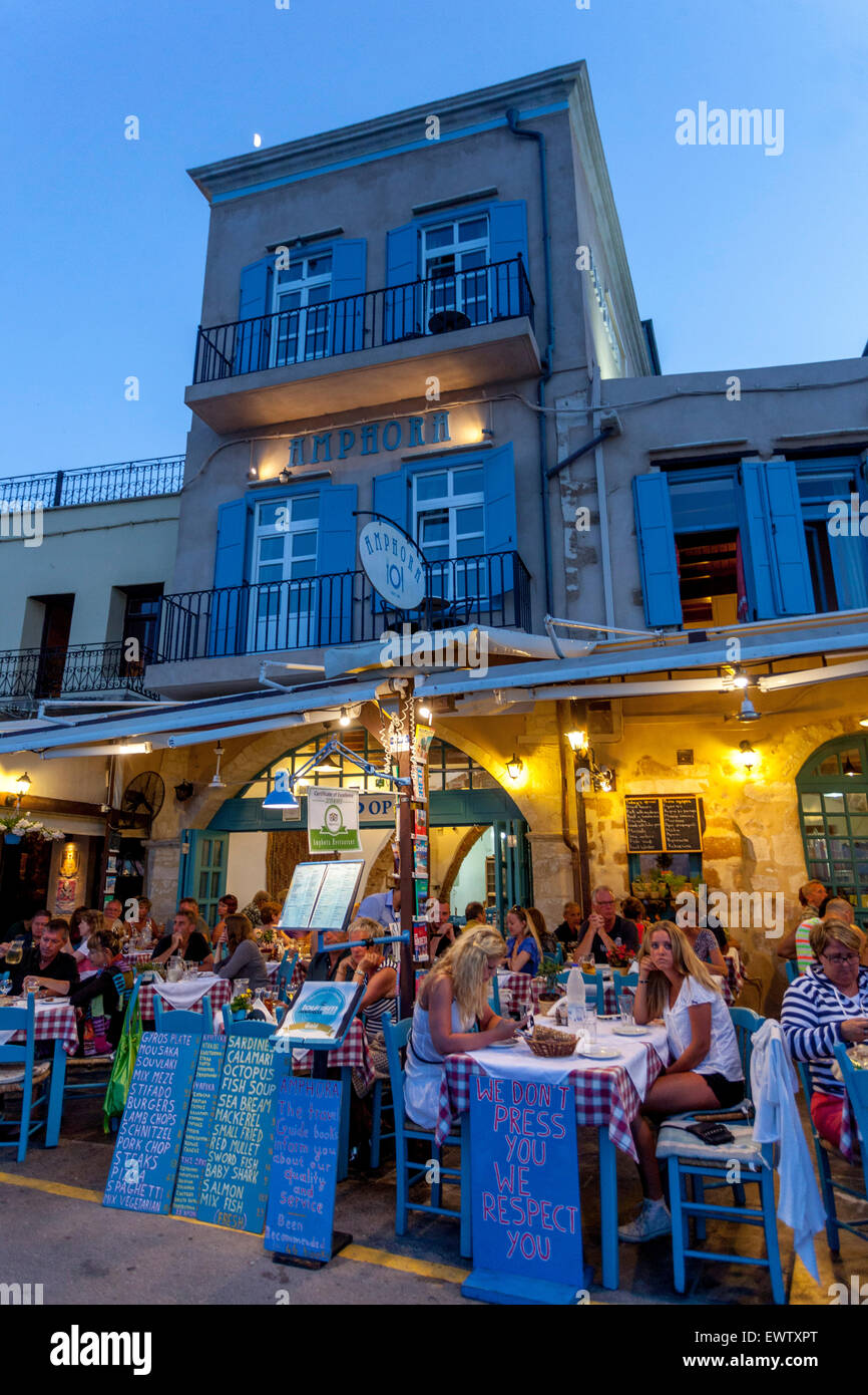 Crete Chania bar Crete, Greece, Cafe in Old Venetian harbour at the dusk Stock Photo