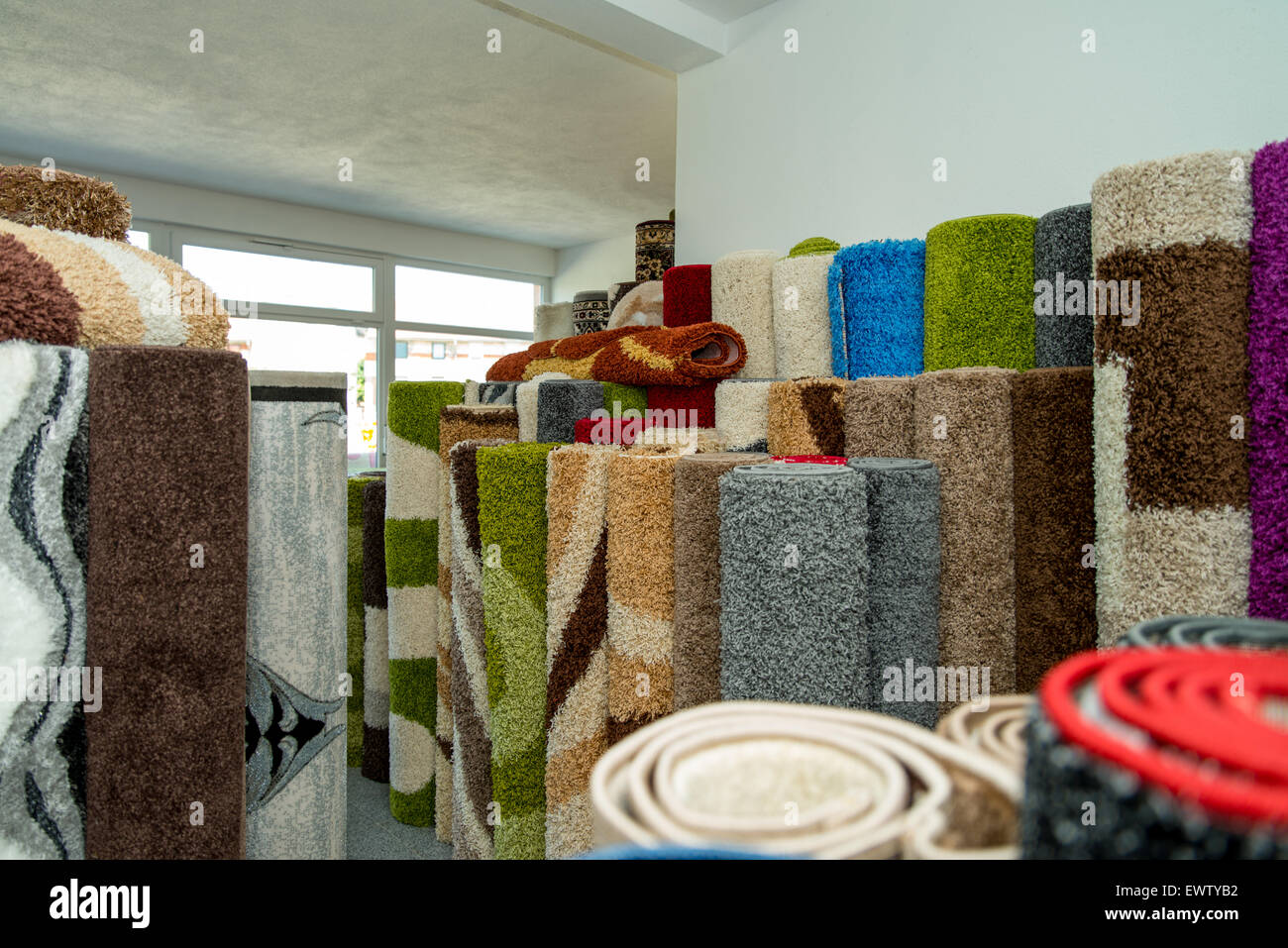 Rolled Rugs Inside A Rug Store Stock Photo Alamy