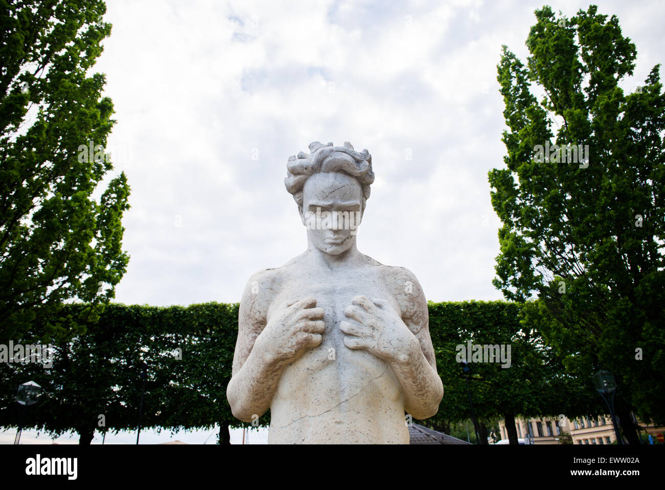 Photo of a sculpture with clouds in the background Stock Photo