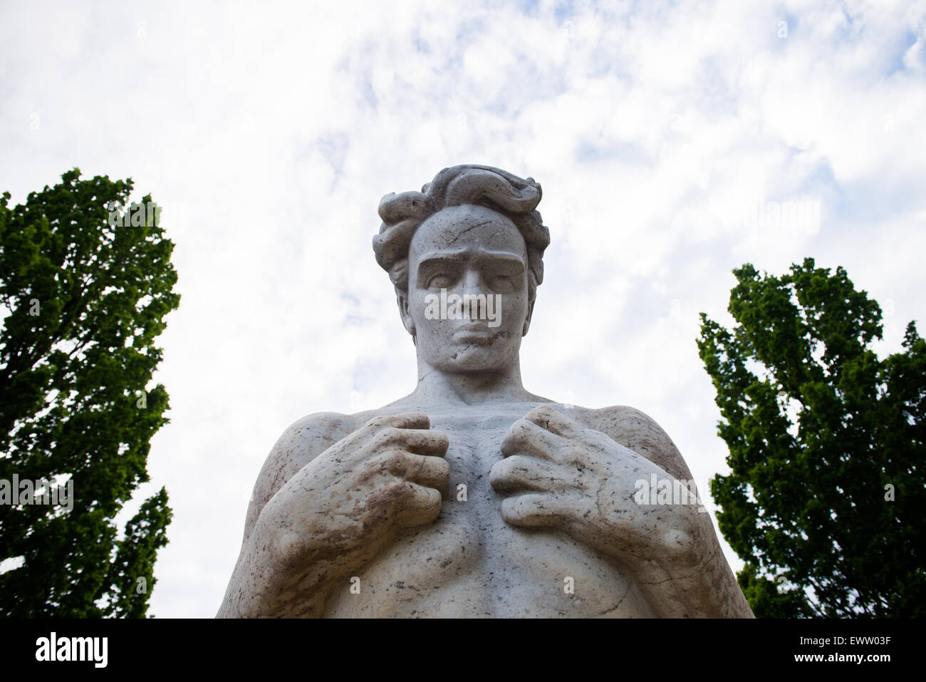 Photo of a sculpture with clouds in the background Stock Photo