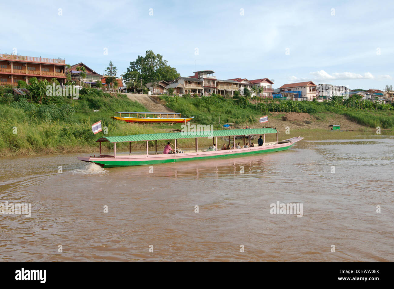 Traditional Thai long-tail boat floating on the Mekong River, Loei province, Thailand Stock Photo