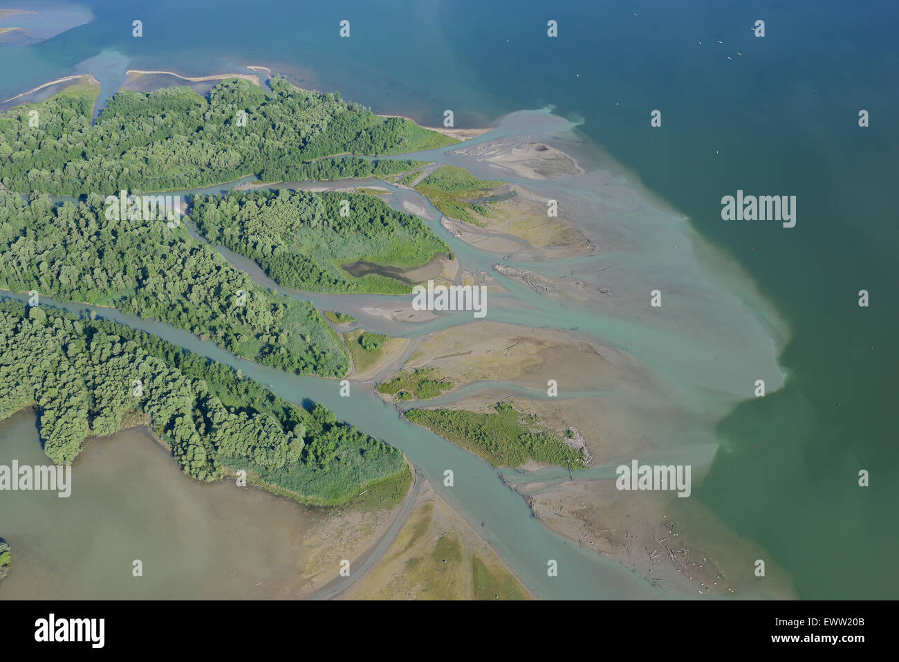 AERIAL VIEW. Delta of the Großache (Tiroler Achen) river feeding into the southern shores of Lake Chiemsee. Übersee, Bavaria, Germany. Stock Photo