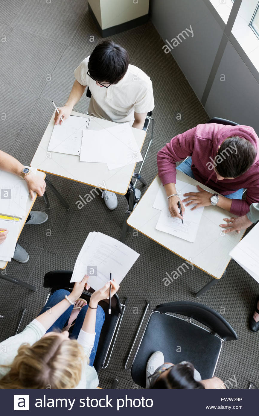 Overhead view college students studying in group classroom Stock Photo