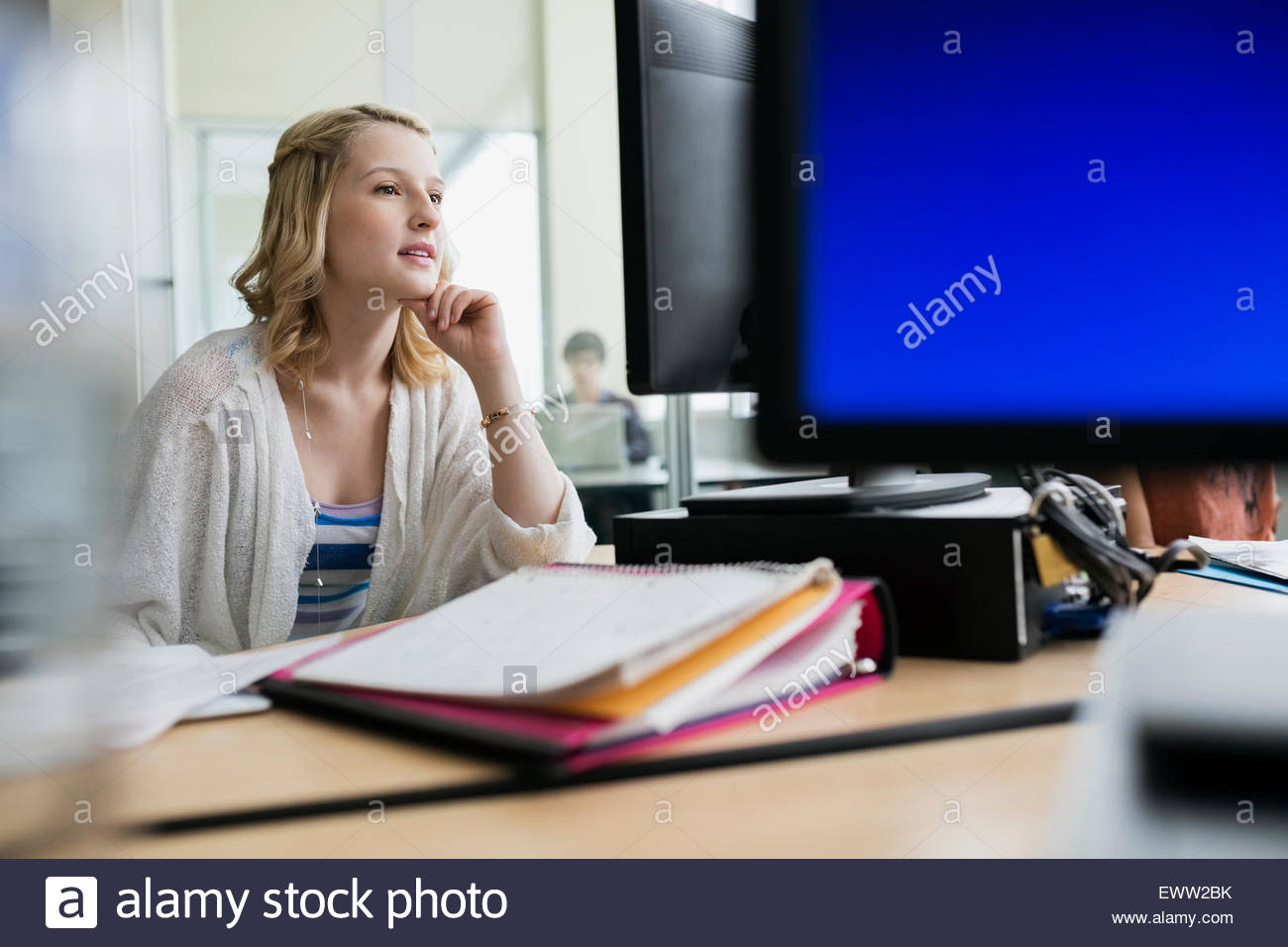 College student studying at computer in classroom Stock Photo