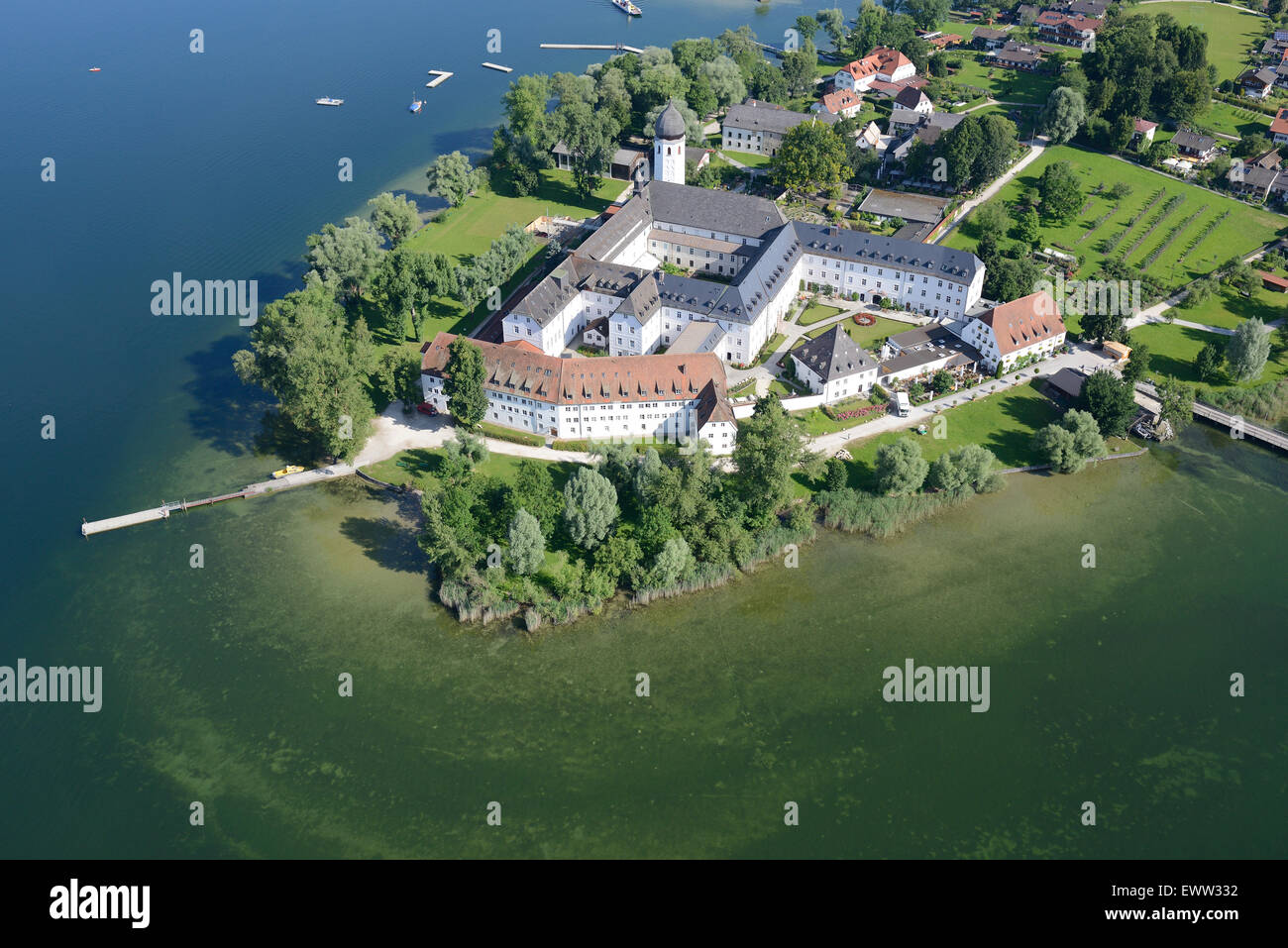 AERIAL VIEW. Benedictine Abbey of Frauenwörth on Frauenchiemsee (also known as Fraueninsel) island. Lake Chiemsee, Bavaria, Germany. Stock Photo