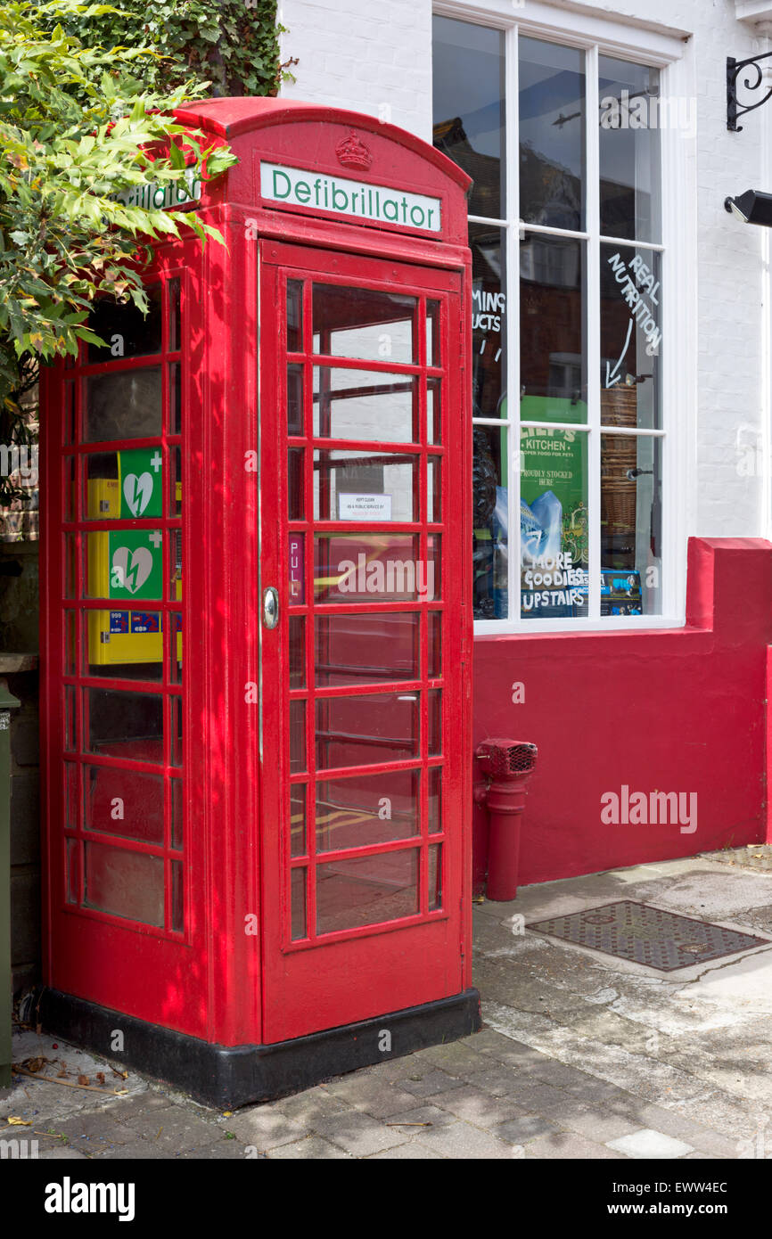 Historic Red phone box used to store a defibrillator Stock Photo