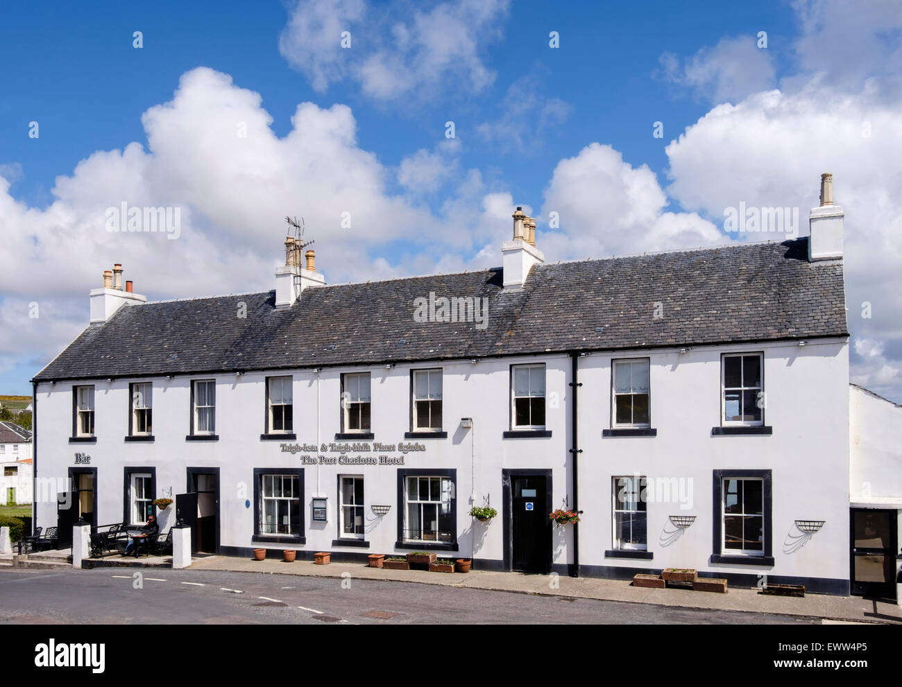The Port Charlotte Hotel and bar on main street through village of Port Charlotte, Isle of Islay, Inner Hebrides, Scotland, UK Stock Photo