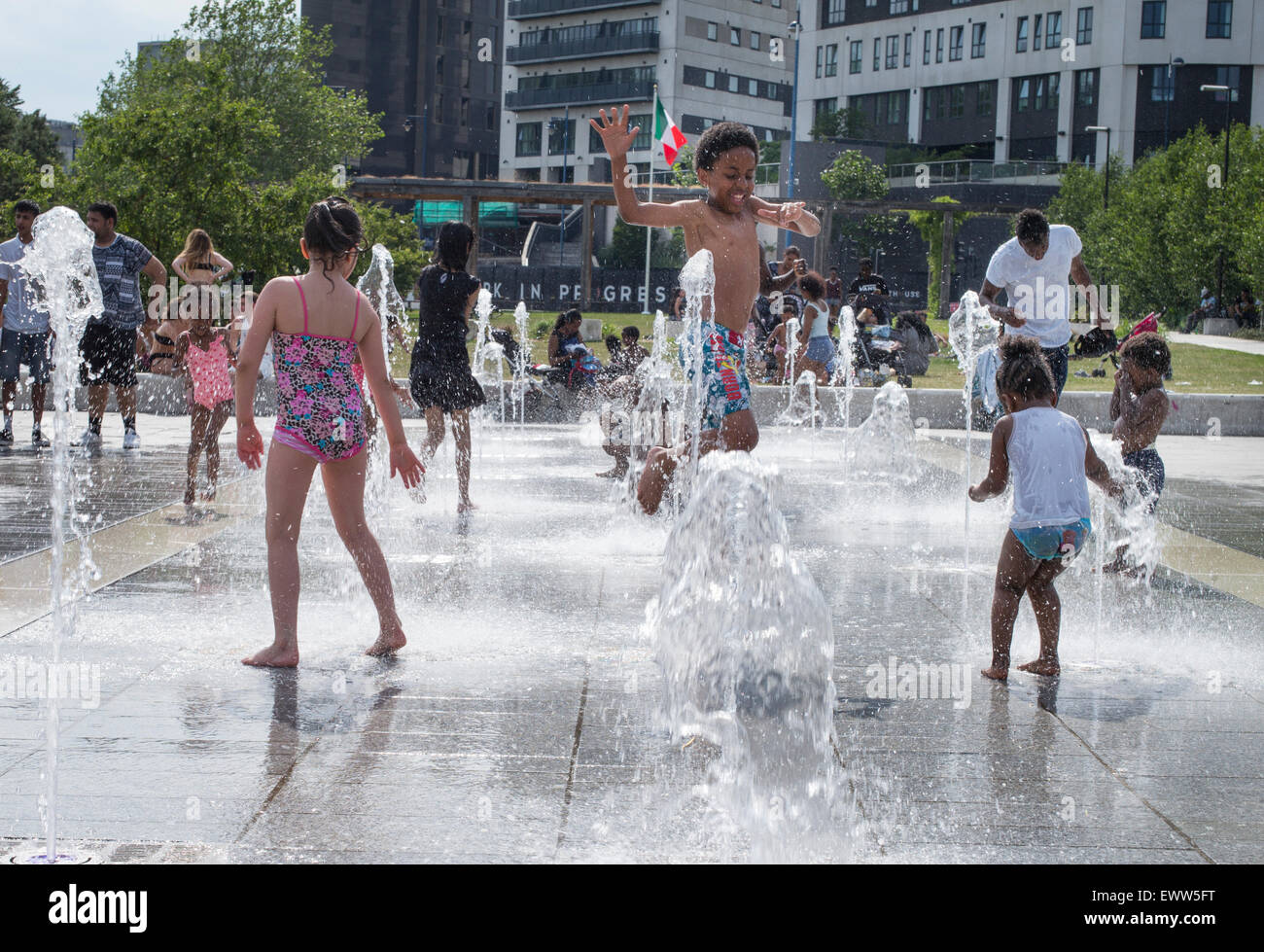 Children cooling off in fountains near Birmingham city centre, as the UK experienced a July record high temperature of 36.7C. Credit:  Andrew Fox/Alamy Live News Stock Photo