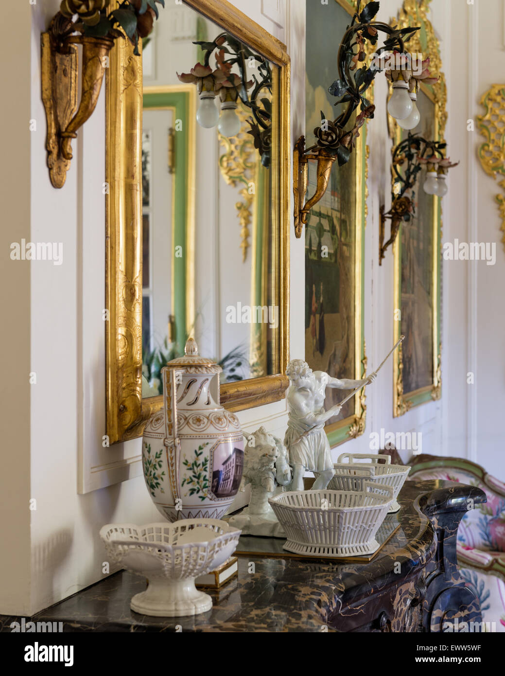 Gilt framed mirror above marble console table Stock Photo Alamy