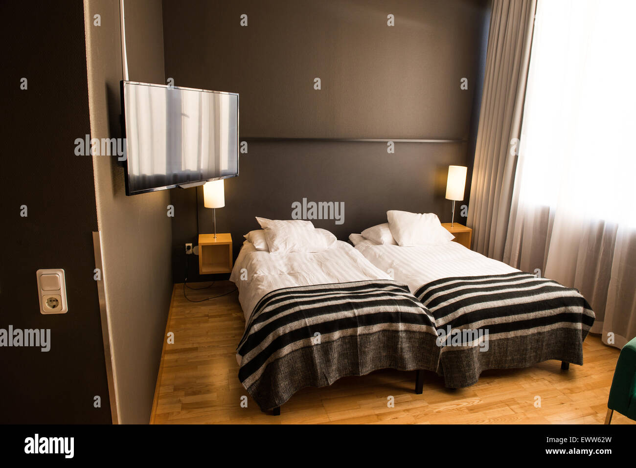 TV in a hotel room, colour photo. Stock Photo