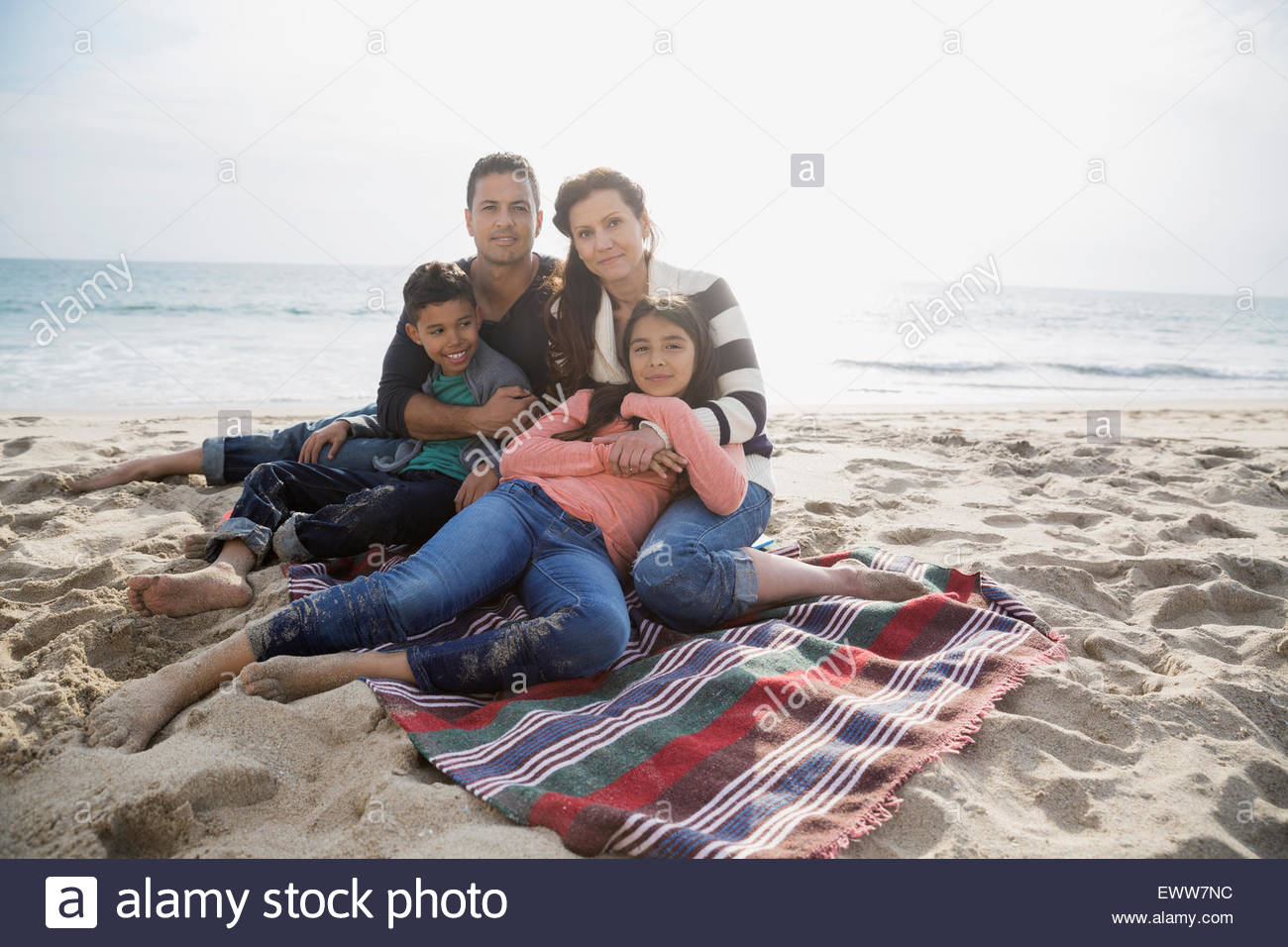 Family relaxing on beach hi-res stock photography and images - Alamy