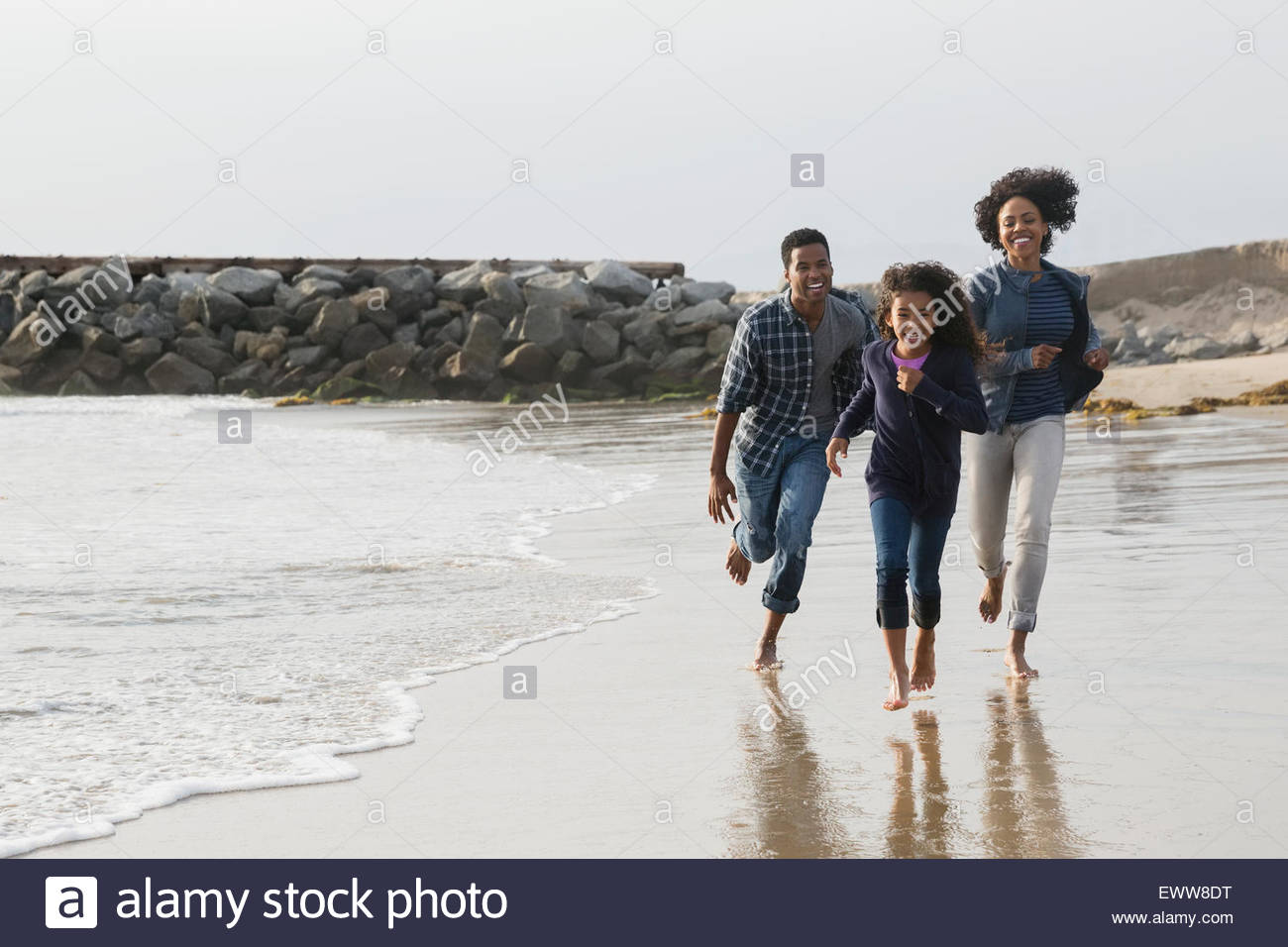 Happy family running on sunny hi-res stock photography and images - Alamy