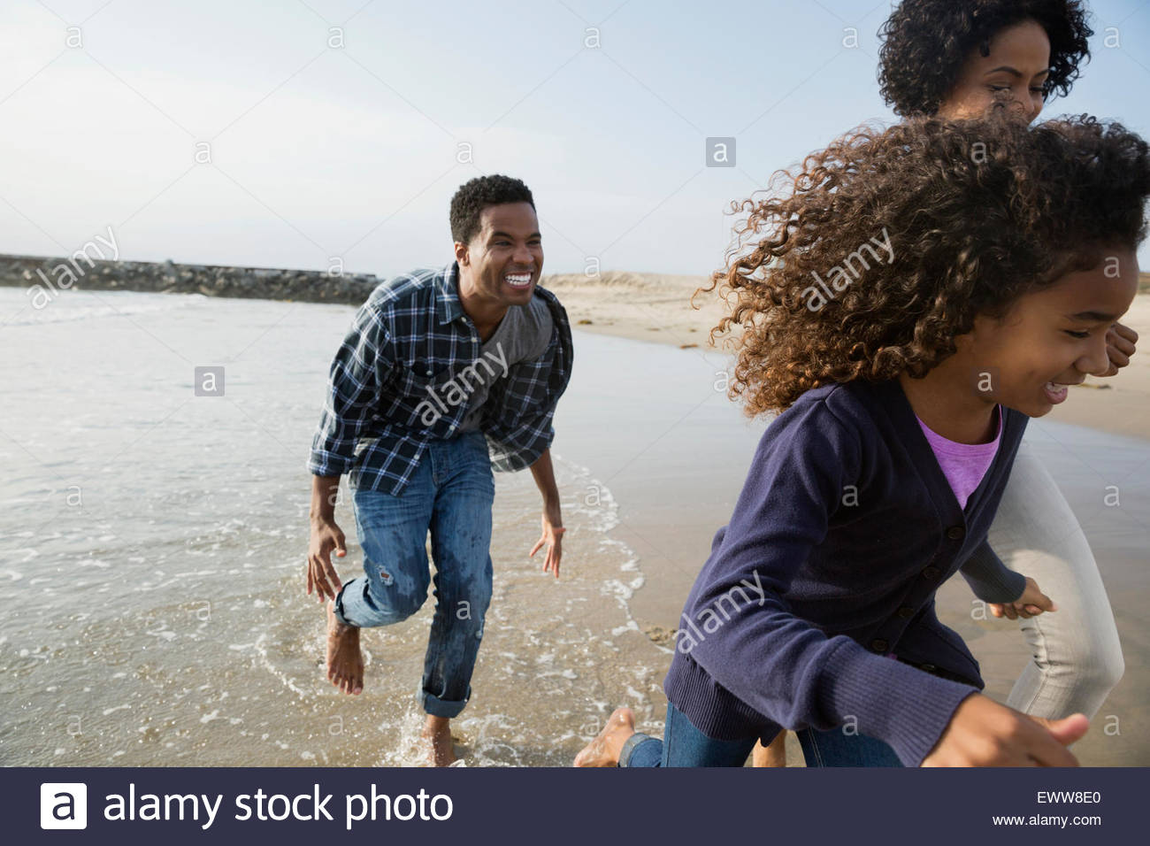 Happy family running on sunny hi-res stock photography and images - Alamy