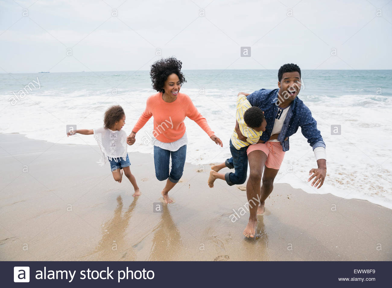 Two girls running holding hands hi-res stock photography and images - Alamy