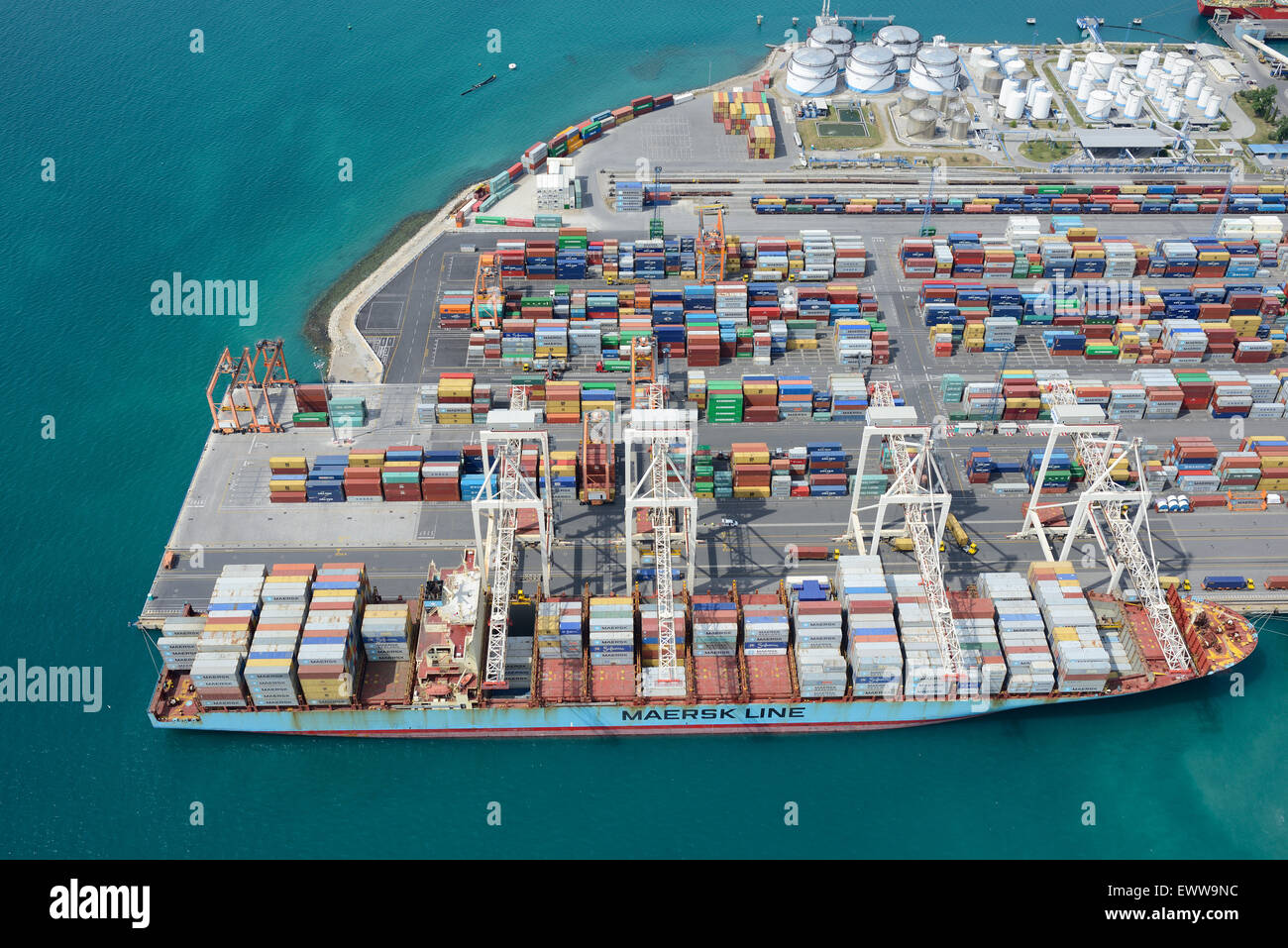 AERIAL VIEW. Containers and container ship on the Adriatic coast. Port of Koper, Slovenia. Stock Photo