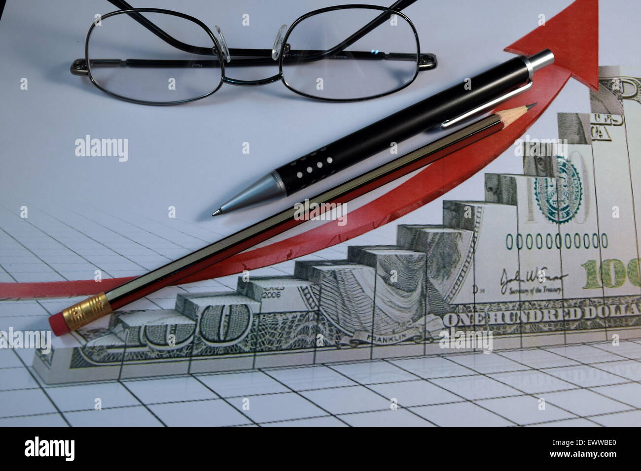 Eye Glasses, pen and pencil over the Formula with calculator Stock