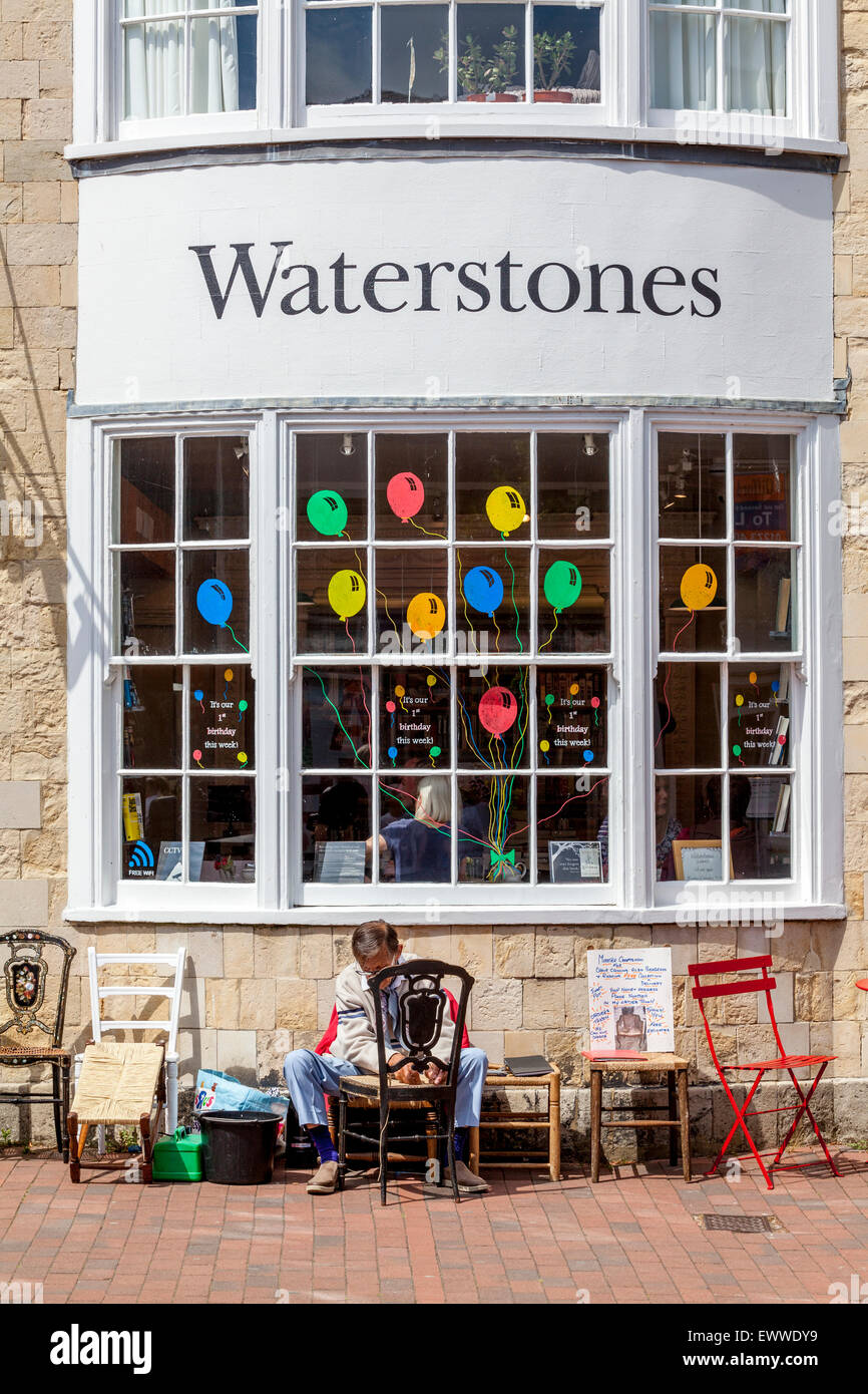 A Local Craftesman Caning A Chair, The High Street, Lewes, Sussex, UK Stock Photo