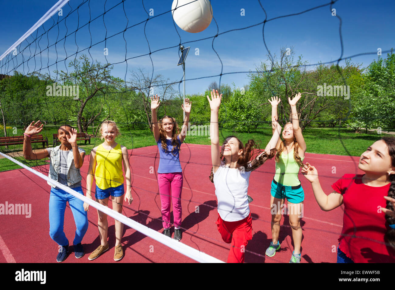 Volleyball game with playing teenage children Stock Photo